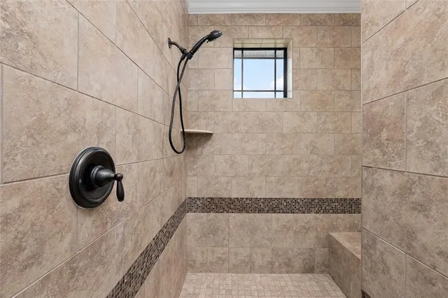 a view of a patio with table and chairs with wooden floor and fence