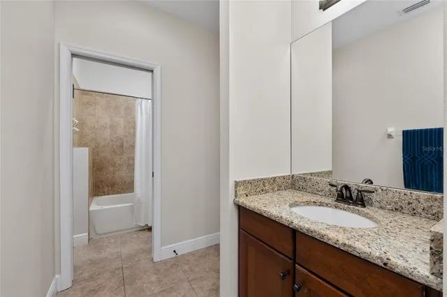 a front view of a house with a garden and yard