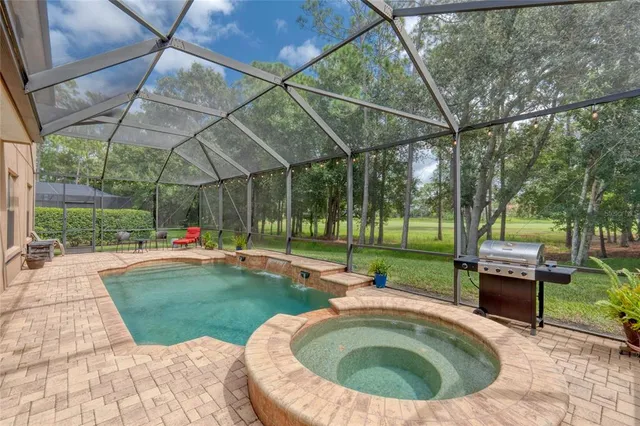 a front view of a house with a yard table and chairs
