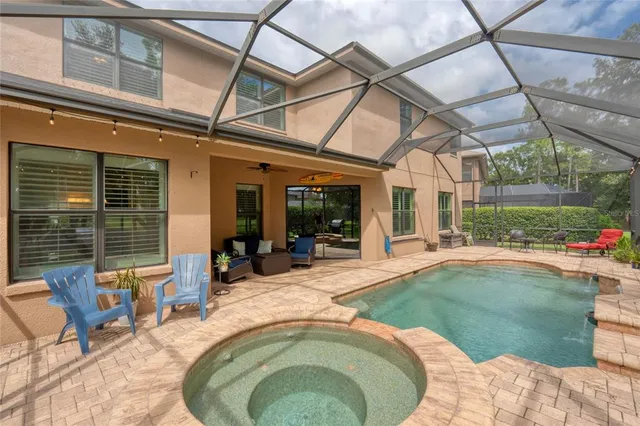 a view of a patio with a table and chairs