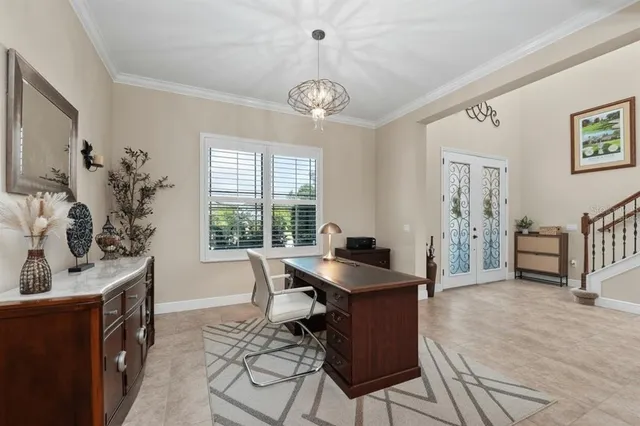 a dining room with furniture and chandelier