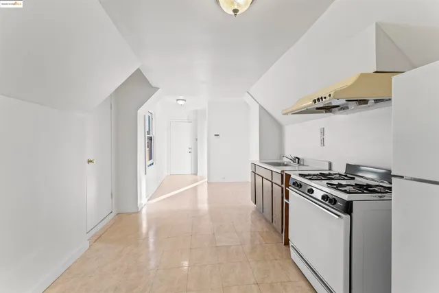 a kitchen with stainless steel appliances a stove and a refrigerator