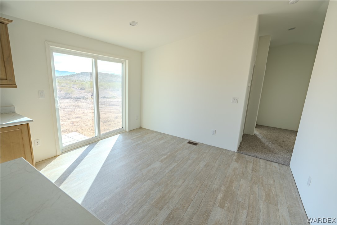 5746 Eden Road Golden Valley, AZ 86413 - Photo 8 of 27 an empty room with windows
