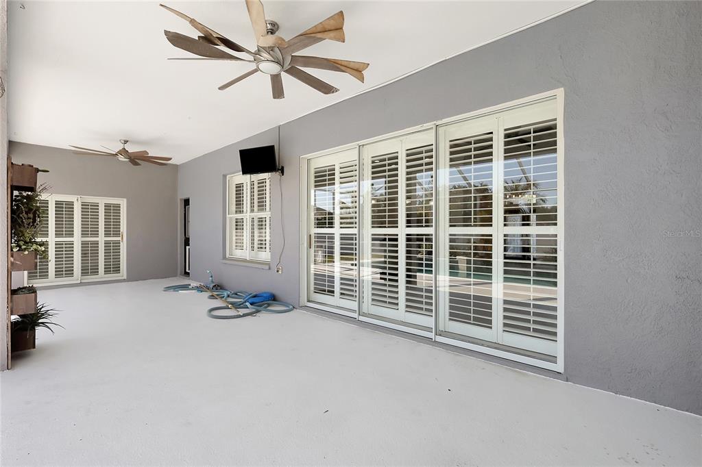 2863 Duncan Tree Circle Valrico, FL 33594 - Photo 49 of 53 a view of an empty room with a window and ceiling fan