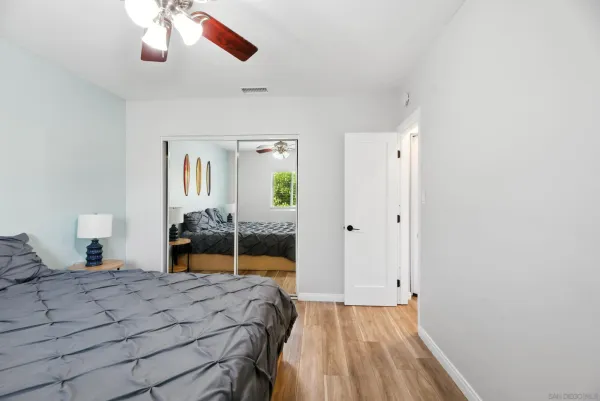 a bedroom with a bed and a dresser