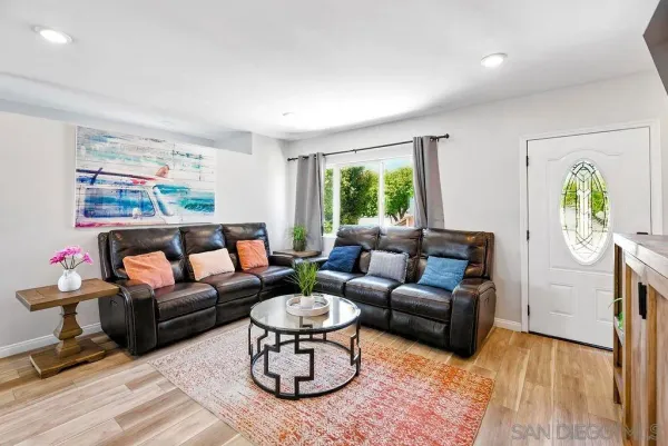 a living room with furniture and a rug