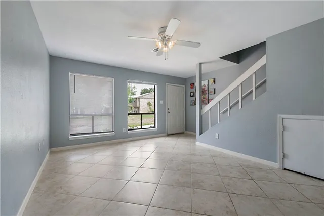 a view of an empty room with a window