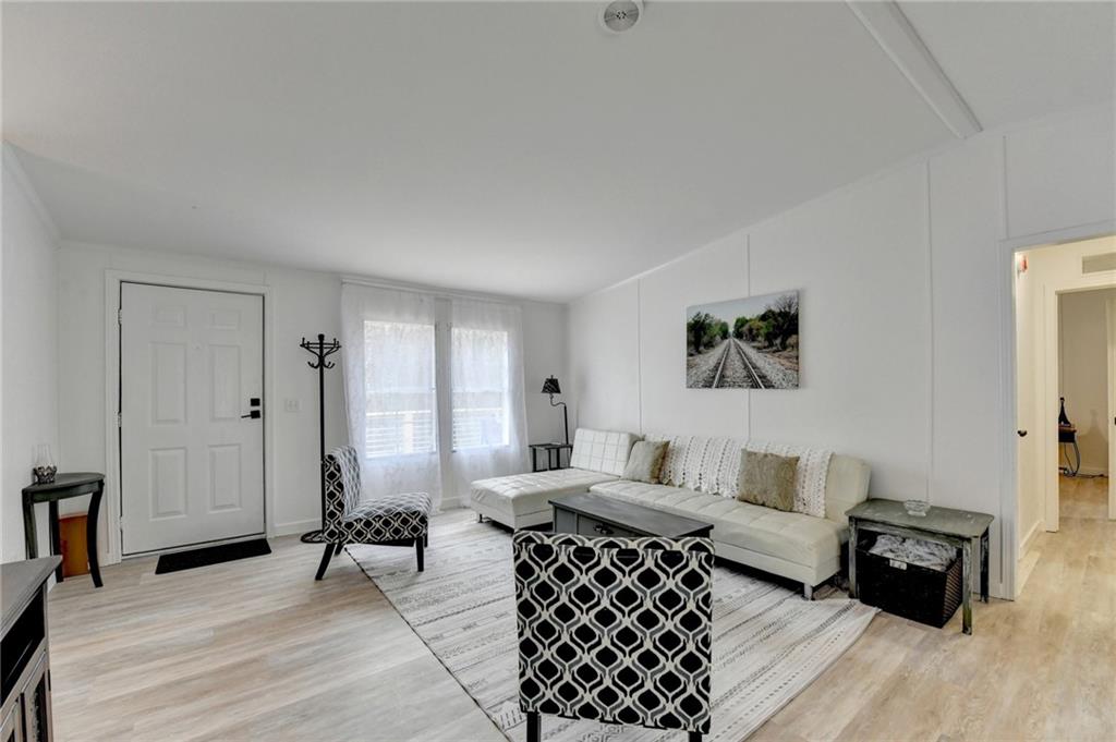 85 Betts Mine Road Dawsonville, GA 30534 - Photo 12 of 18 a living room with furniture and a wooden floor