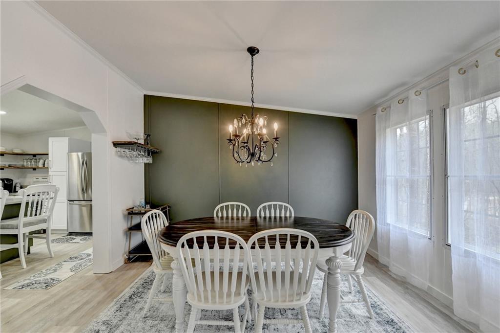 85 Betts Mine Road Dawsonville, GA 30534 - Photo 15 of 18 a view of a dining room with furniture window and wooden floor