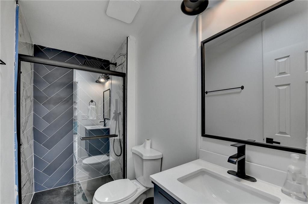 85 Betts Mine Road Dawsonville, GA 30534 - Photo 7 of 18 a bathroom with a sink toilet and shower