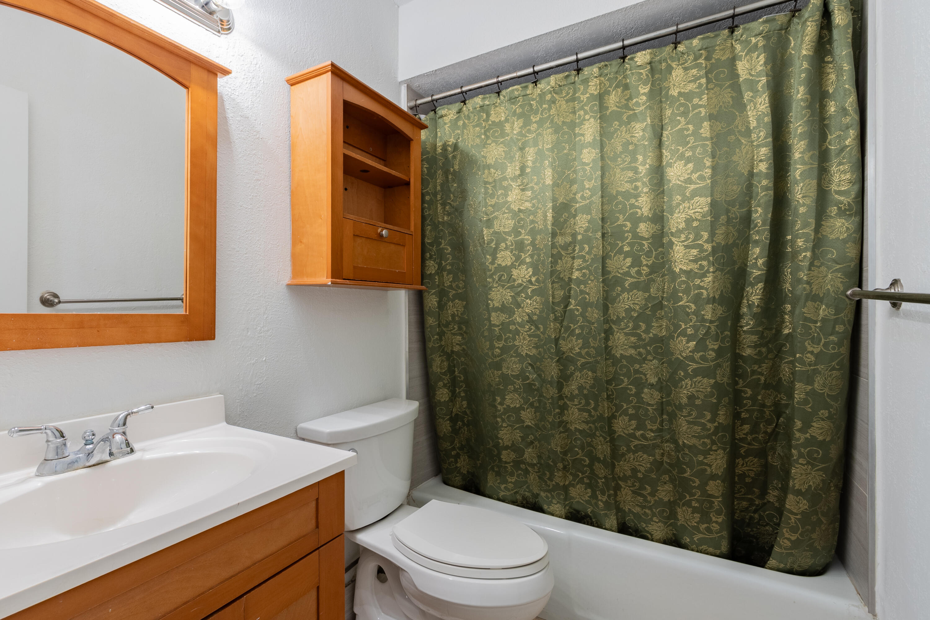 9459 Southwest 76th Street, Unit R8 Miami, FL 33173 - Photo 12 of 21 a bathroom with a toilet a sink and a mirror