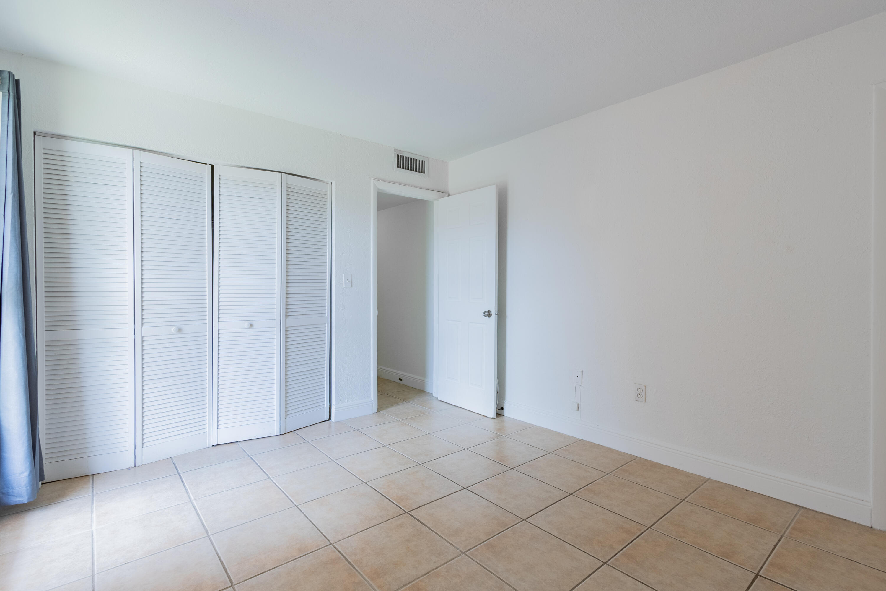 9459 Southwest 76th Street, Unit R8 Miami, FL 33173 - Photo 13 of 21 a view of an empty room