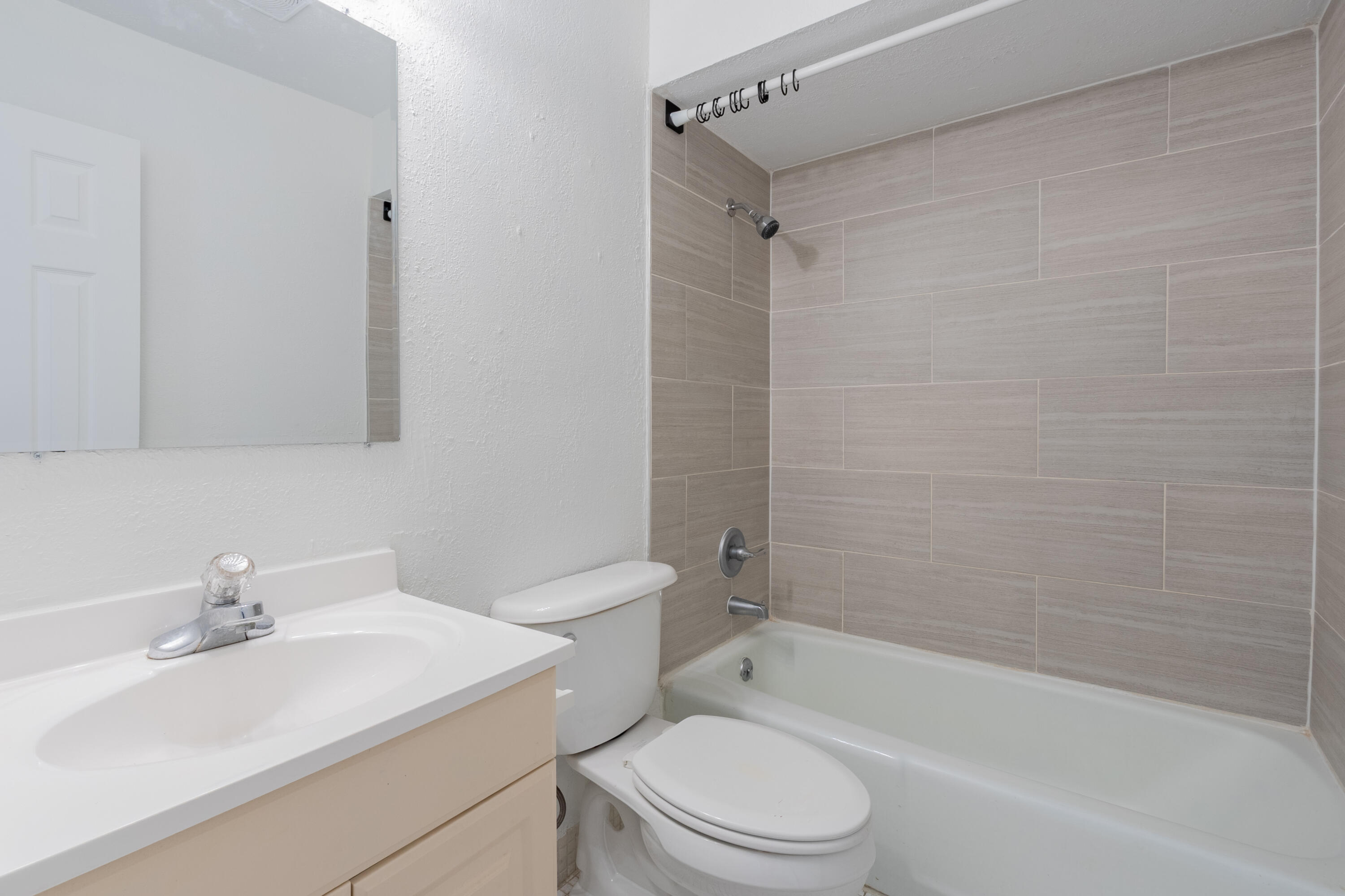 9459 Southwest 76th Street, Unit R8 Miami, FL 33173 - Photo 17 of 21 a bathroom with a sink toilet and shower