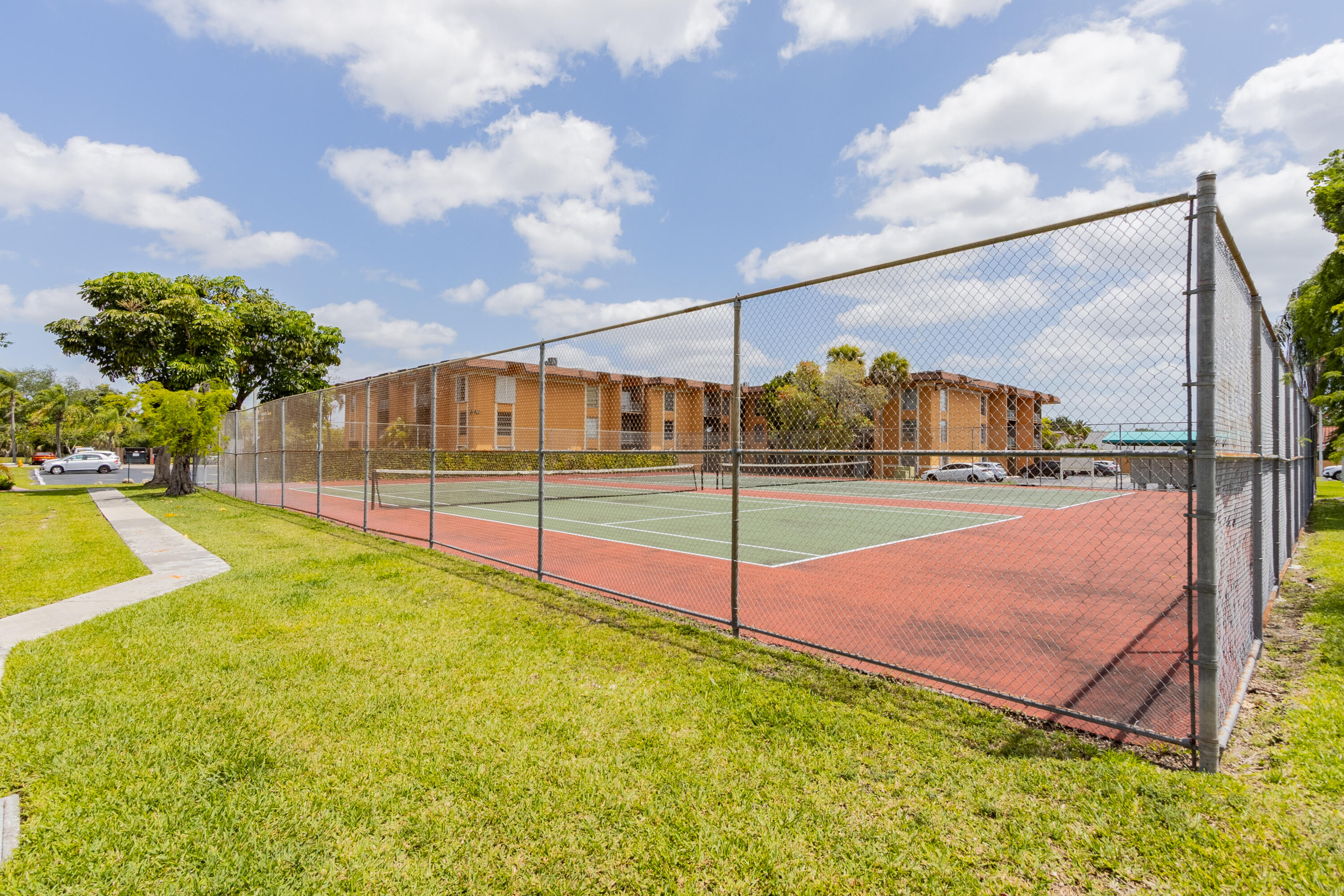 9459 Southwest 76th Street, Unit R8 Miami, FL 33173 - Photo 19 of 21 a view of an outdoor space and swimming pool