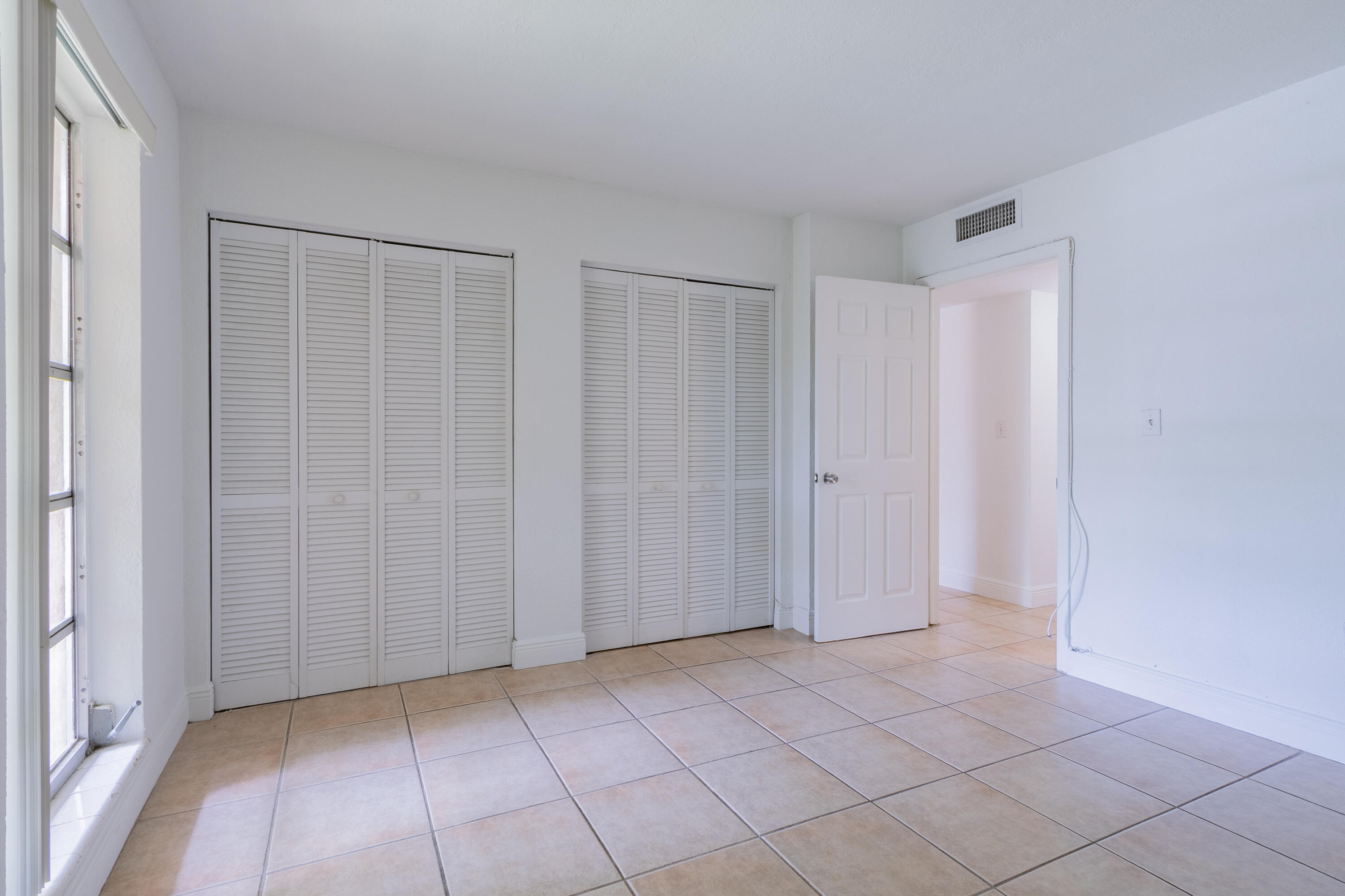 9459 Southwest 76th Street, Unit R8 Miami, FL 33173 - Photo 10 of 21 a view of an empty room