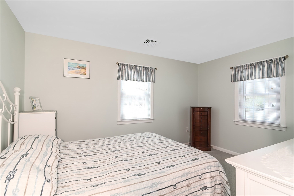 60 Security Street Barnstable, MA 02601 - Photo 18 of 32 a bedroom with a bed and a window