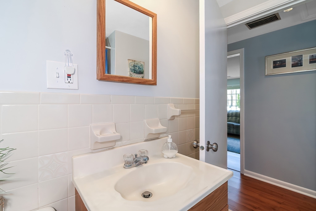60 Security Street Barnstable, MA 02601 - Photo 19 of 32 a bathroom with a sink and a mirror