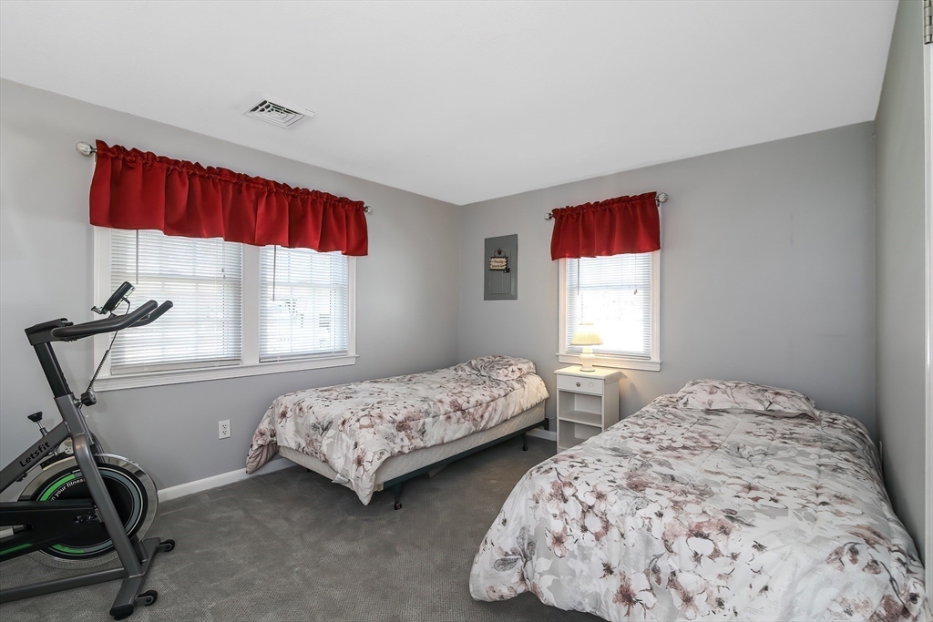 60 Security Street Barnstable, MA 02601 - Photo 23 of 32 a bedroom with two beds and a window