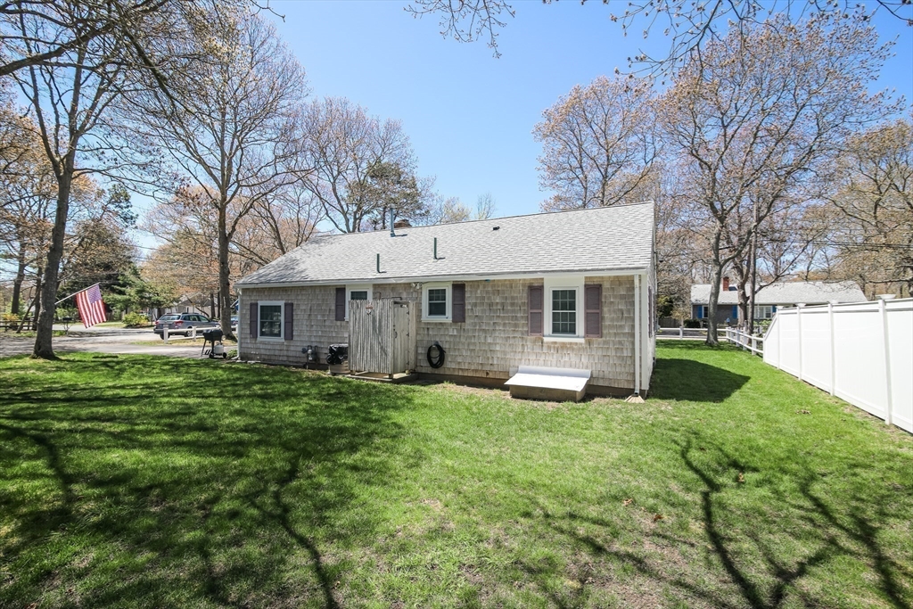 60 Security Street Barnstable, MA 02601 - Photo 29 of 32 a front view of a house with yard and green space