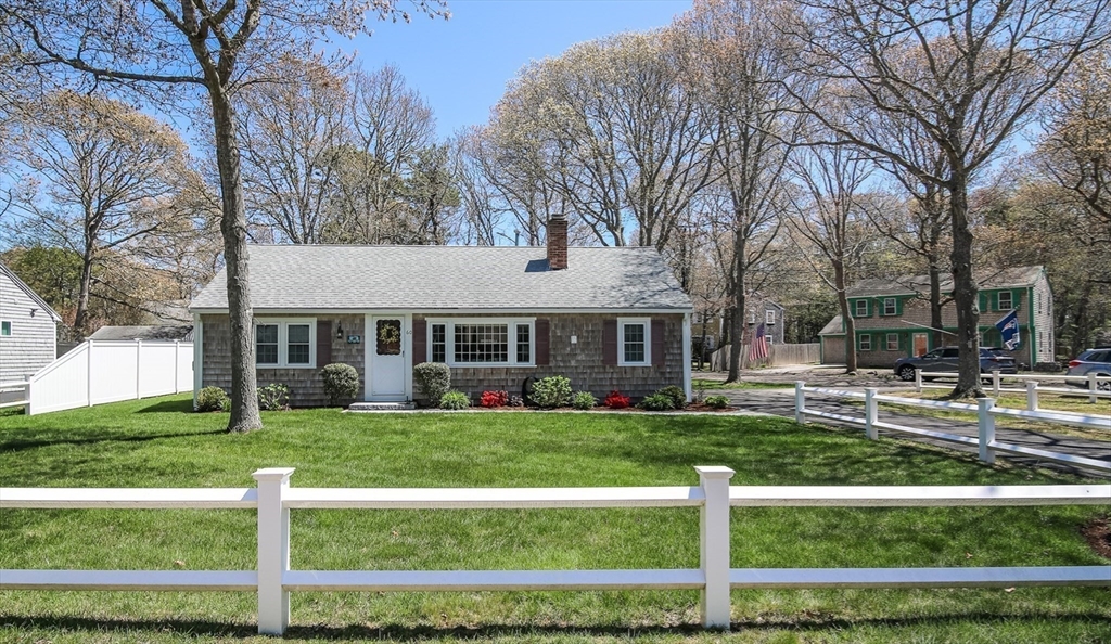 60 Security Street Barnstable, MA 02601 - Photo 3 of 32 a view of a house with a yard and sitting area