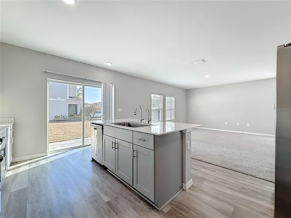 a kitchen with cabinets and stainless steel appliances