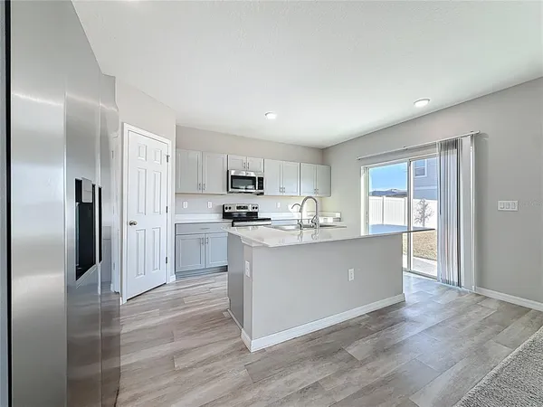 a view of an empty room and closet area