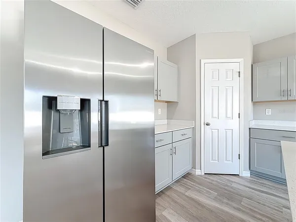 a bathroom with a sink a toilet and a large mirror