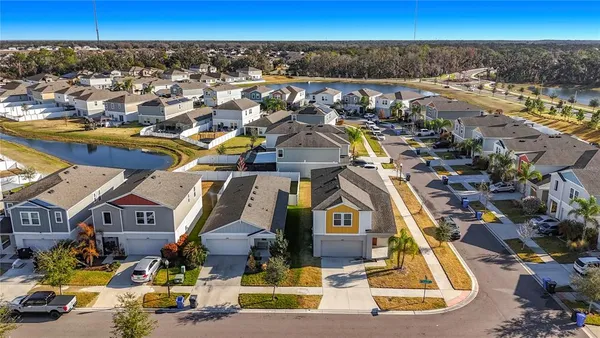 an aerial view of residential houses with outdoor space