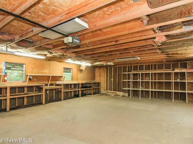 206 Shambley Road Mebane, NC 27302 - Photo 16 of 16 Parking Lot/Garage. Lots of space in Garage including shelves and work bench