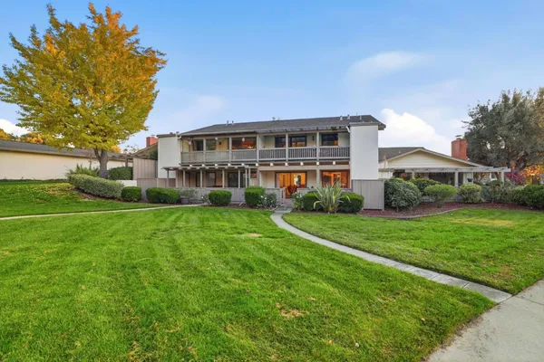 a view of a house with a backyard