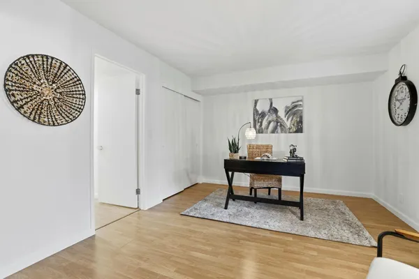 a workspace with furniture and wooden floor