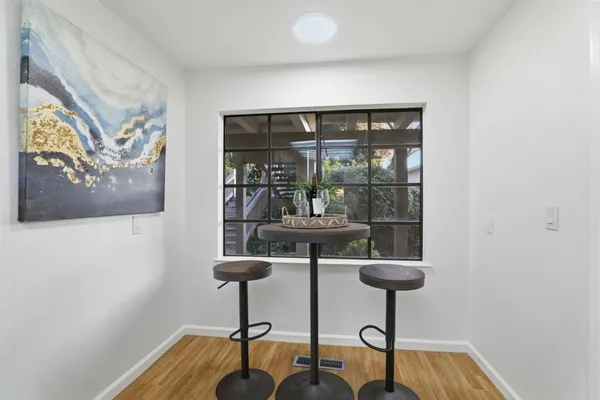 a view of hall way with furniture and window