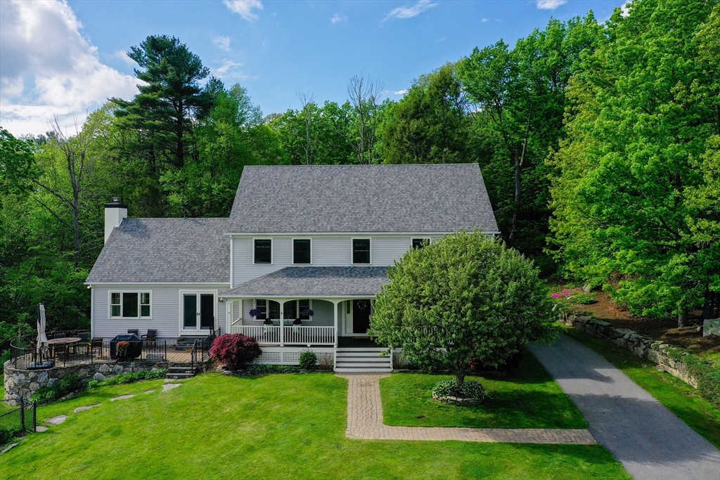 a aerial view of a house with a yard patio and swimming pool