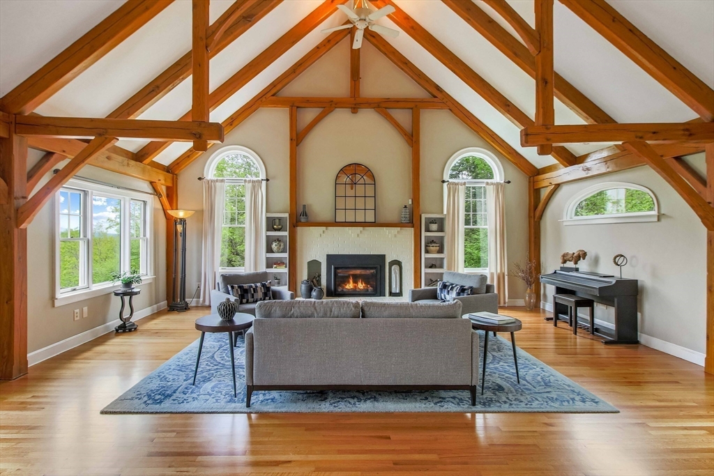 15 Allen Hill Road Princeton, MA 01541 - Photo 7 of 42 a living room with fireplace furniture and a large window