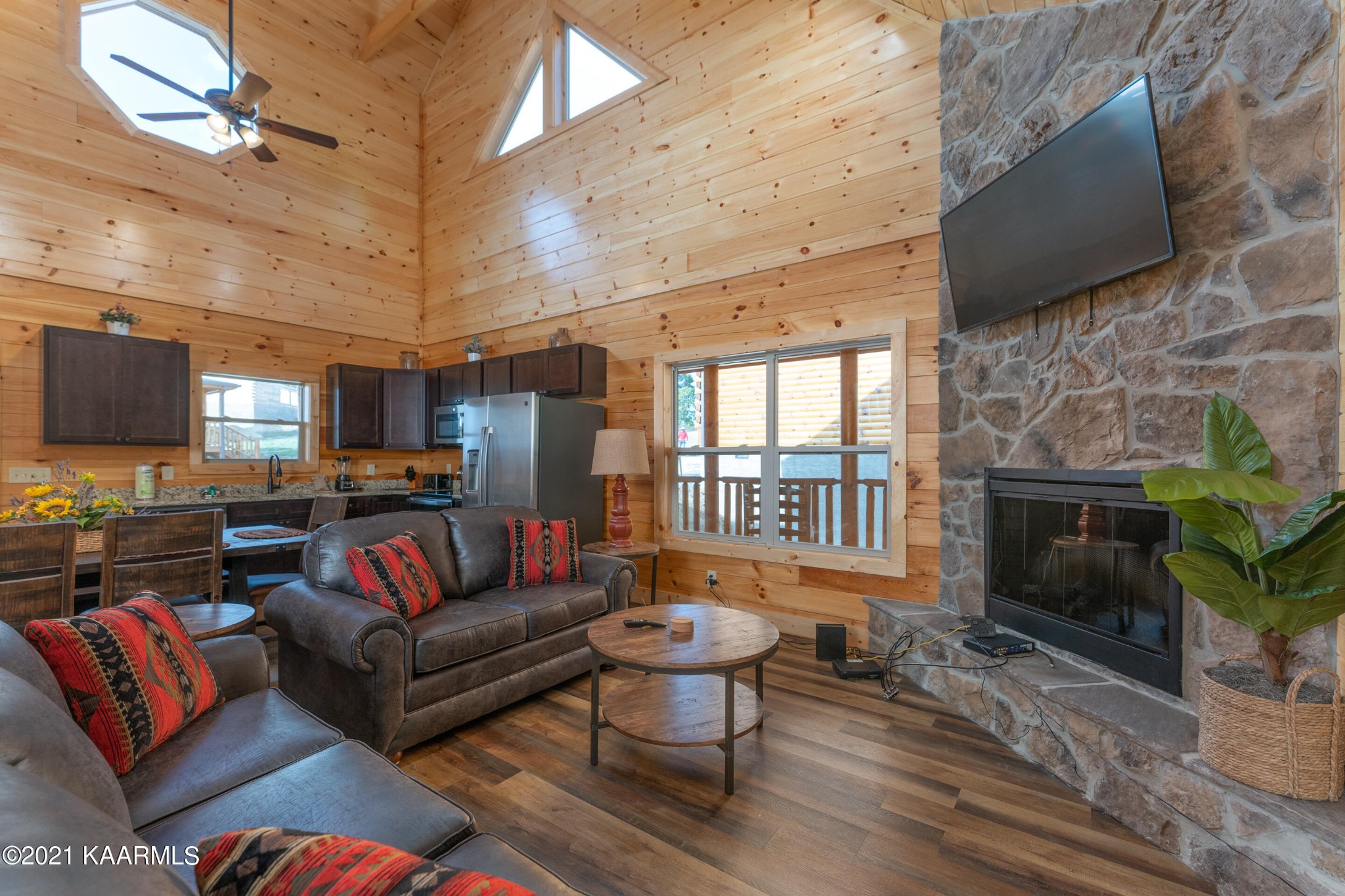 304 City View Way Sevierville, TN 37863 - Photo 4 of 34 a living room with furniture a fireplace and a flat screen tv