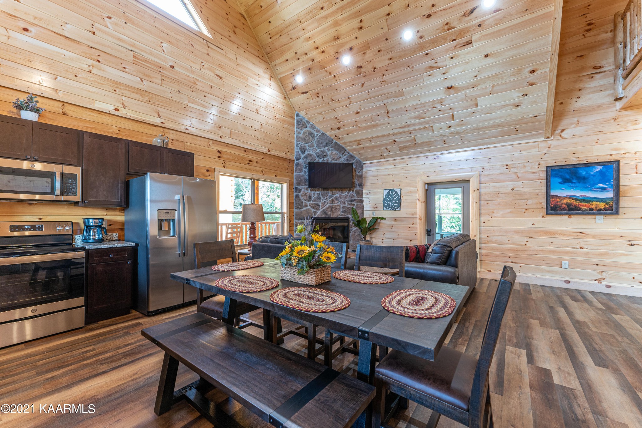 304 City View Way Sevierville, TN 37863 - Photo 10 of 34 a view of a dining room with furniture window and wooden floor