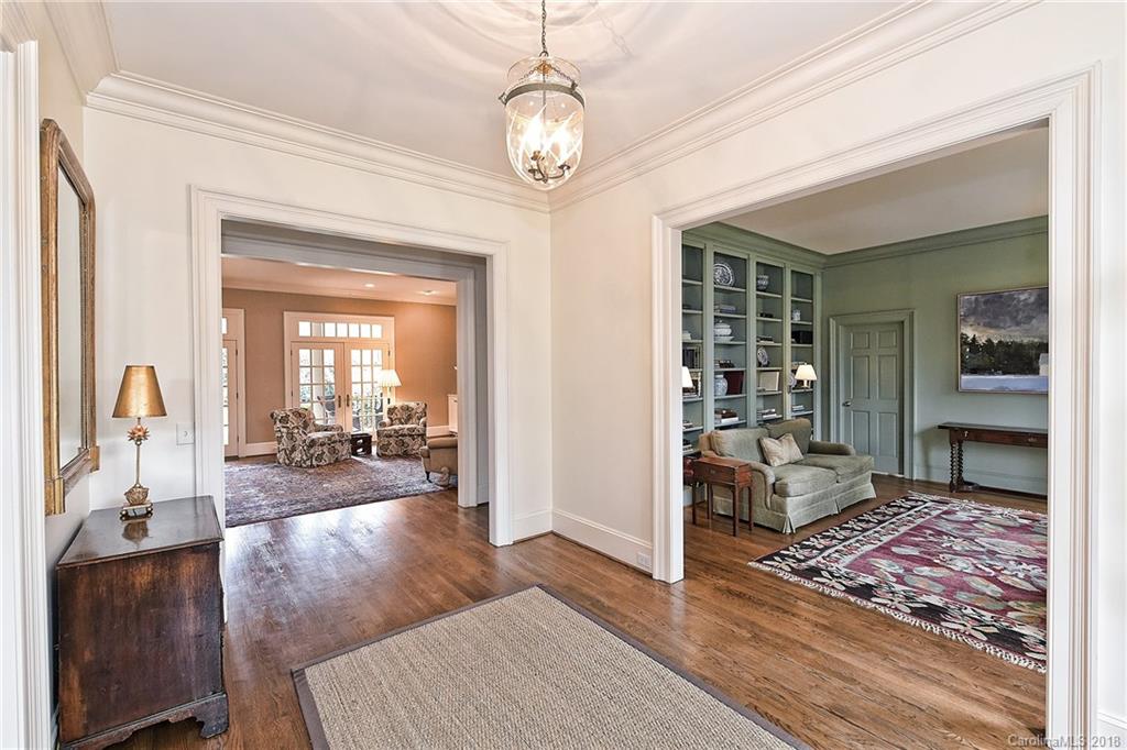 1912 Harris Road Charlotte, NC 28211 - Photo 4 of 36 a view of a livingroom with furniture wooden floor and a chandelier