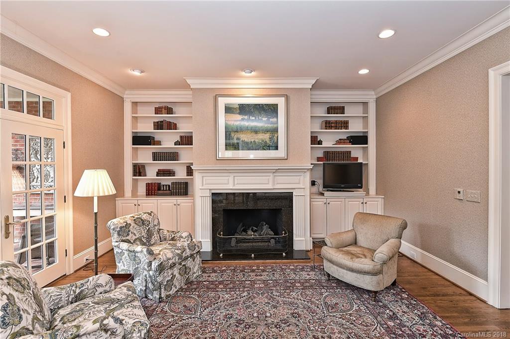 1912 Harris Road Charlotte, NC 28211 - Photo 8 of 36 a living room with furniture and a fireplace