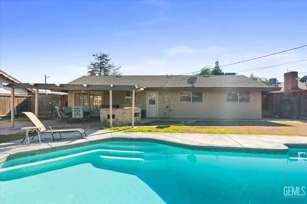 a front view of a house with swimming pool