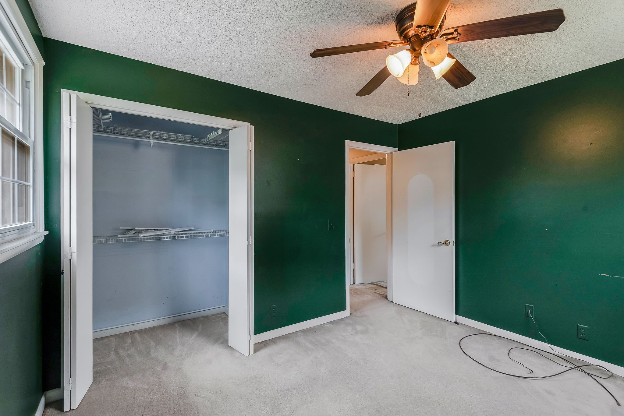 4848 Concord Drive Hermitage, TN 37076 - Photo 17 of 42 an empty room with closet and fan