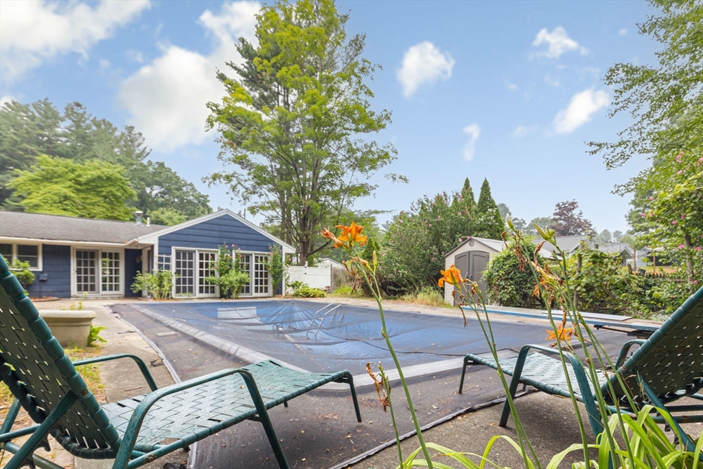 12 Janet Road Chelmsford, MA 01824 - Photo 19 of 21 a patio with table and chairs and potted plants