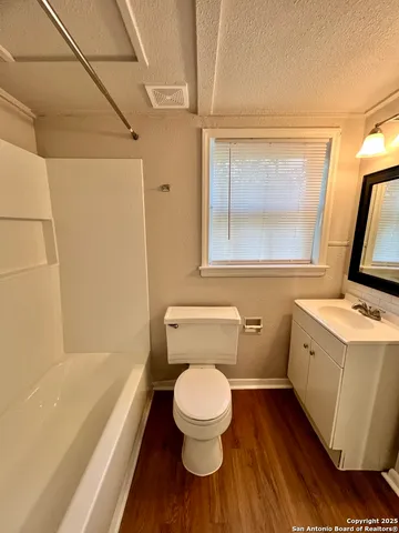 a bathroom with a toilet and a sink