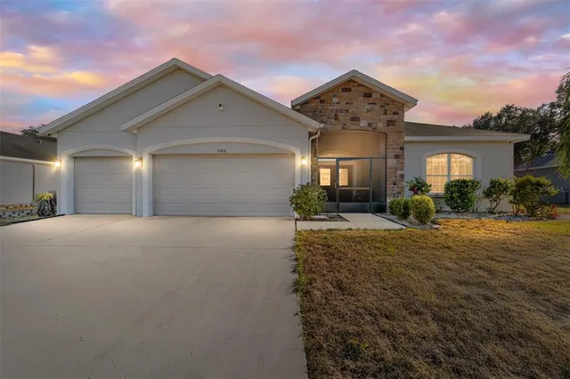 a living room with furniture a rug and a window