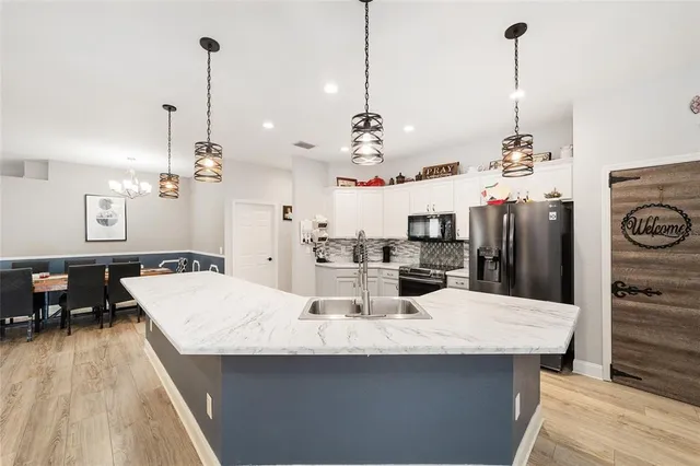 a bedroom with a bed gym equipment and a desk
