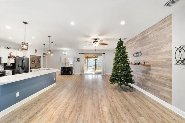 a bed room with a bed a closet and a chandelier