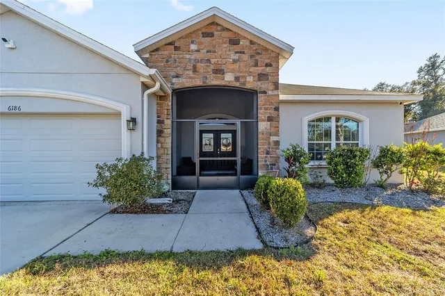 a kitchen with a sink stainless steel appliances and cabinets