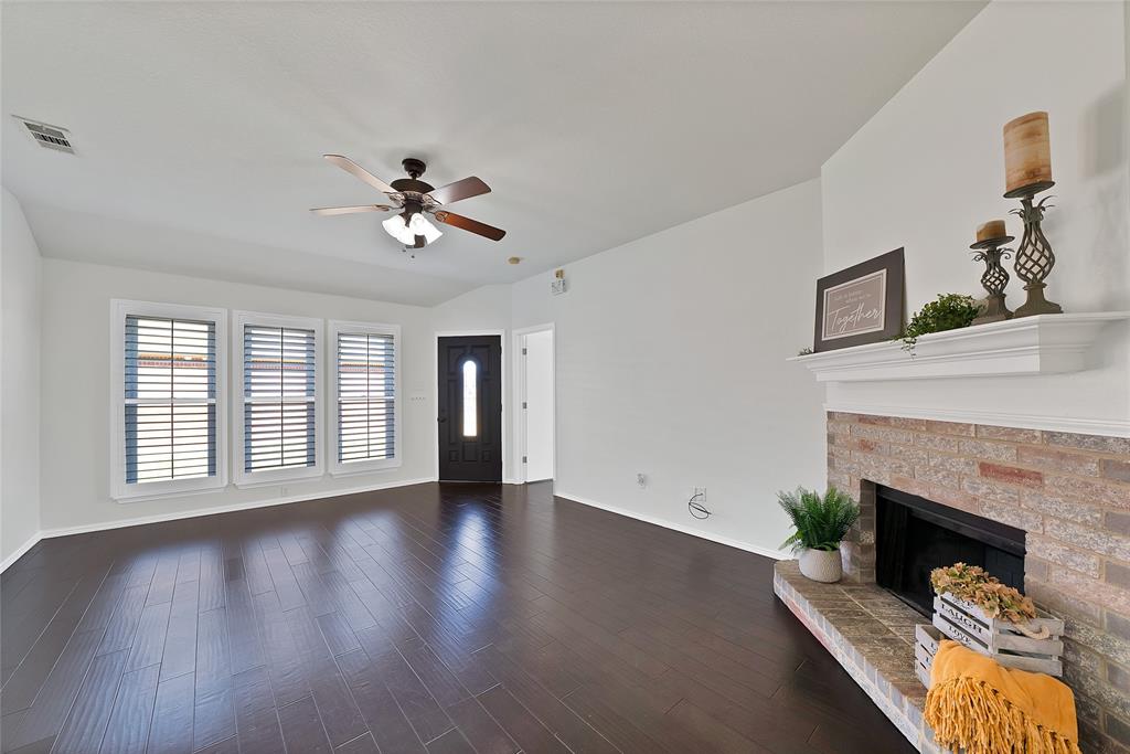 308 South Chestnut Street Forney, TX 75126 - Photo 14 of 25 a living room with furniture and a fireplace