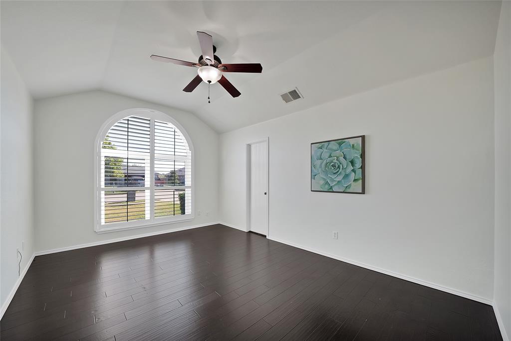 308 South Chestnut Street Forney, TX 75126 - Photo 17 of 25 a view of an empty room with wooden floor and a window