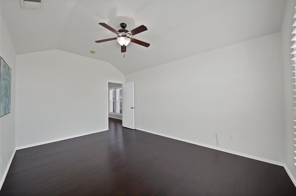 308 South Chestnut Street Forney, TX 75126 - Photo 18 of 25 a view of a big room with wooden floor closet and windows