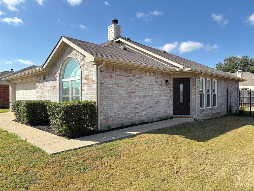 308 South Chestnut Street Forney, TX 75126 - Photo 5 of 25 a front view of a house with a yard